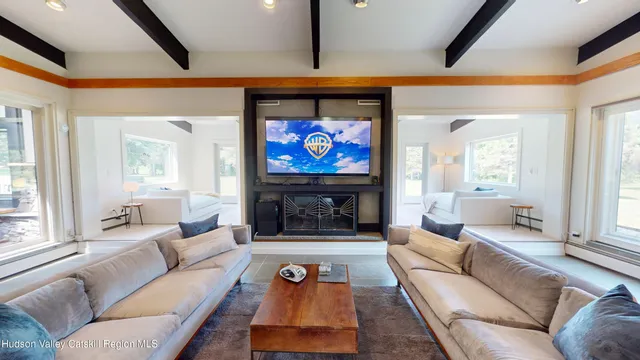 a living room with furniture and a table