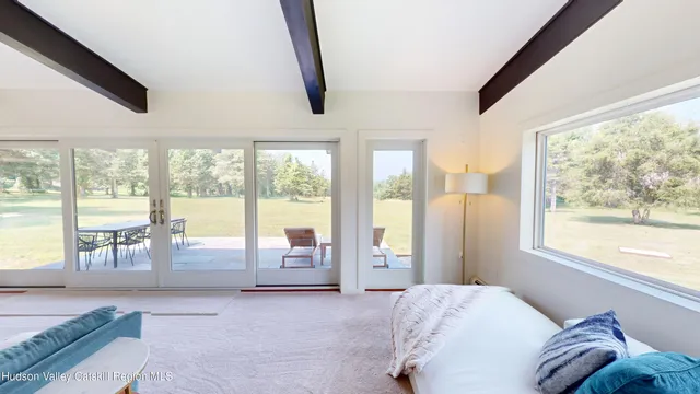 a bed room with a bed and a window