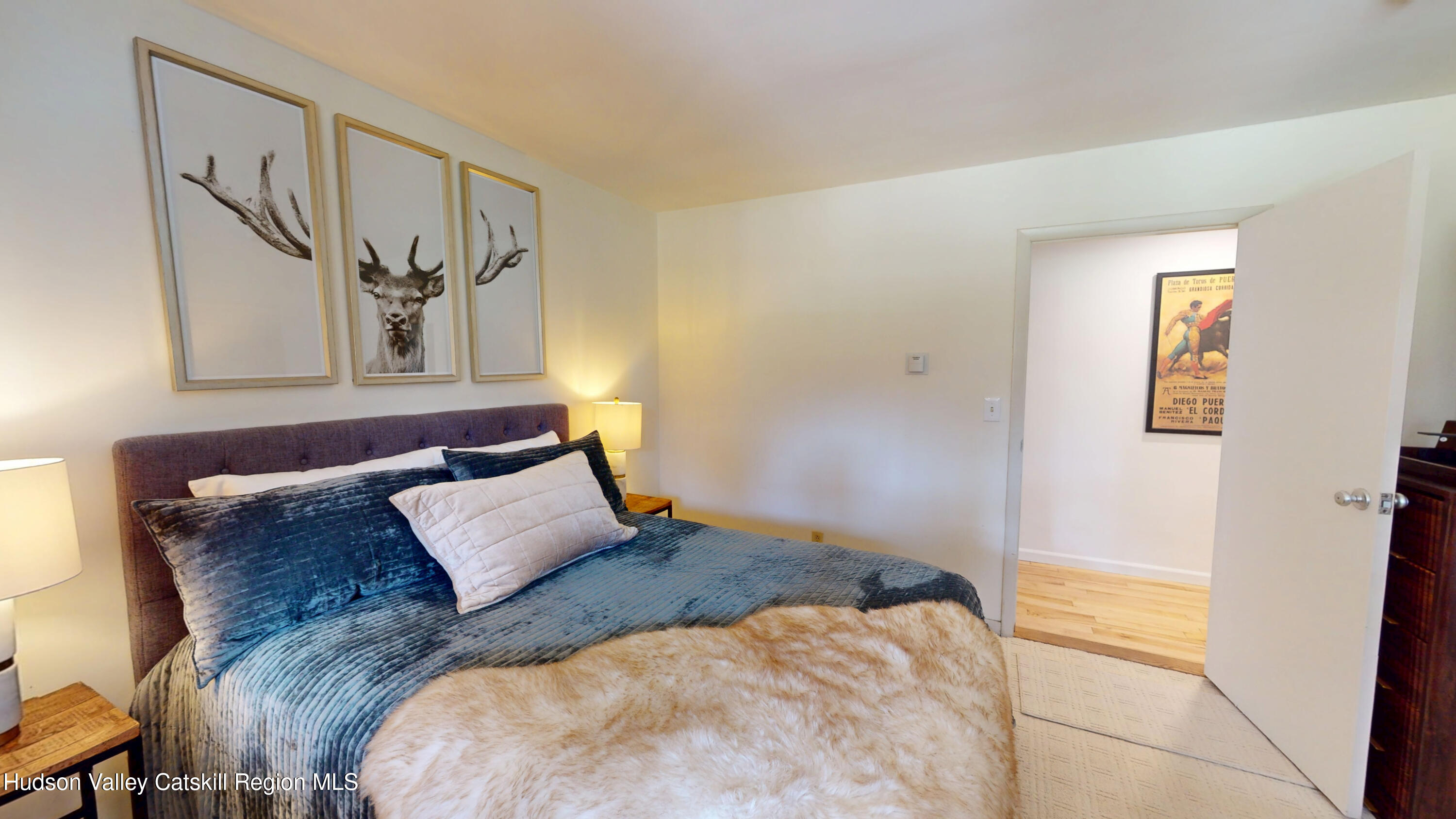 16 Spring Road Hudson, NY 12534 - Photo 21 of 64 a bedroom with a bed and a painting on the wall