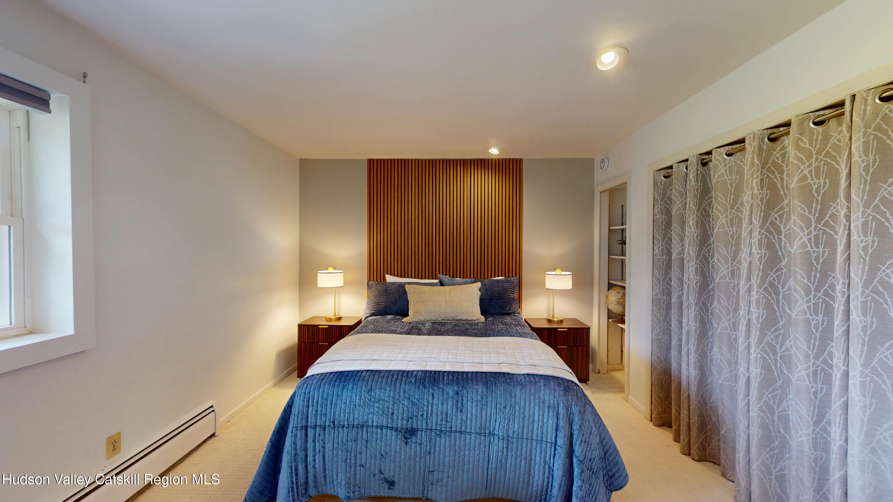 16 Spring Road Hudson, NY 12534 - Photo 24 of 64 a bed room with a bed and a mirror