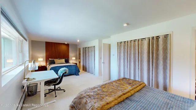 a living room with furniture rug and wooden floor