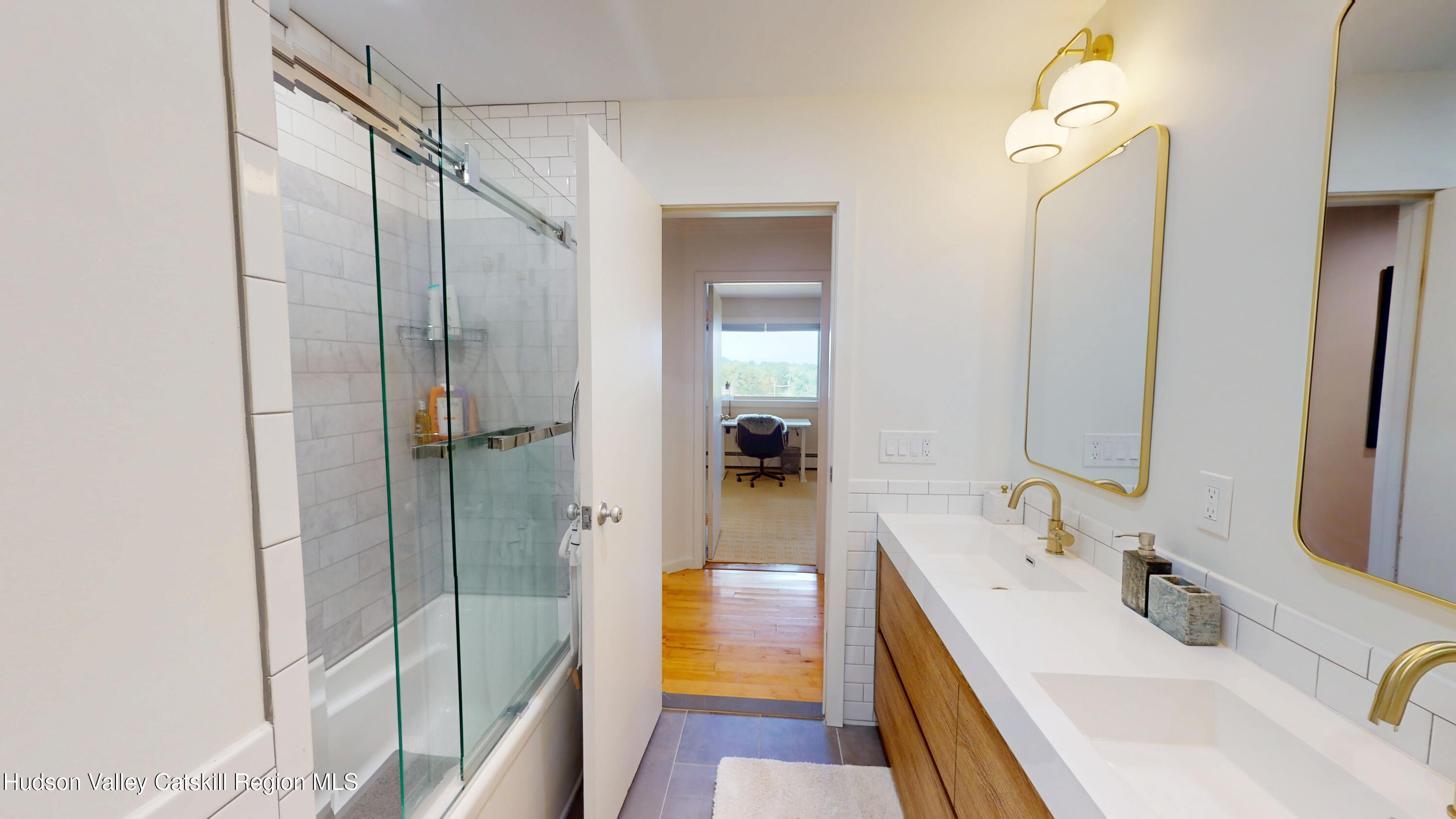 16 Spring Road Hudson, NY 12534 - Photo 28 of 64 a bathroom with a tub sink vanity and mirror