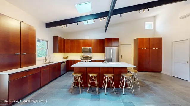 a large kitchen with a table and chairs