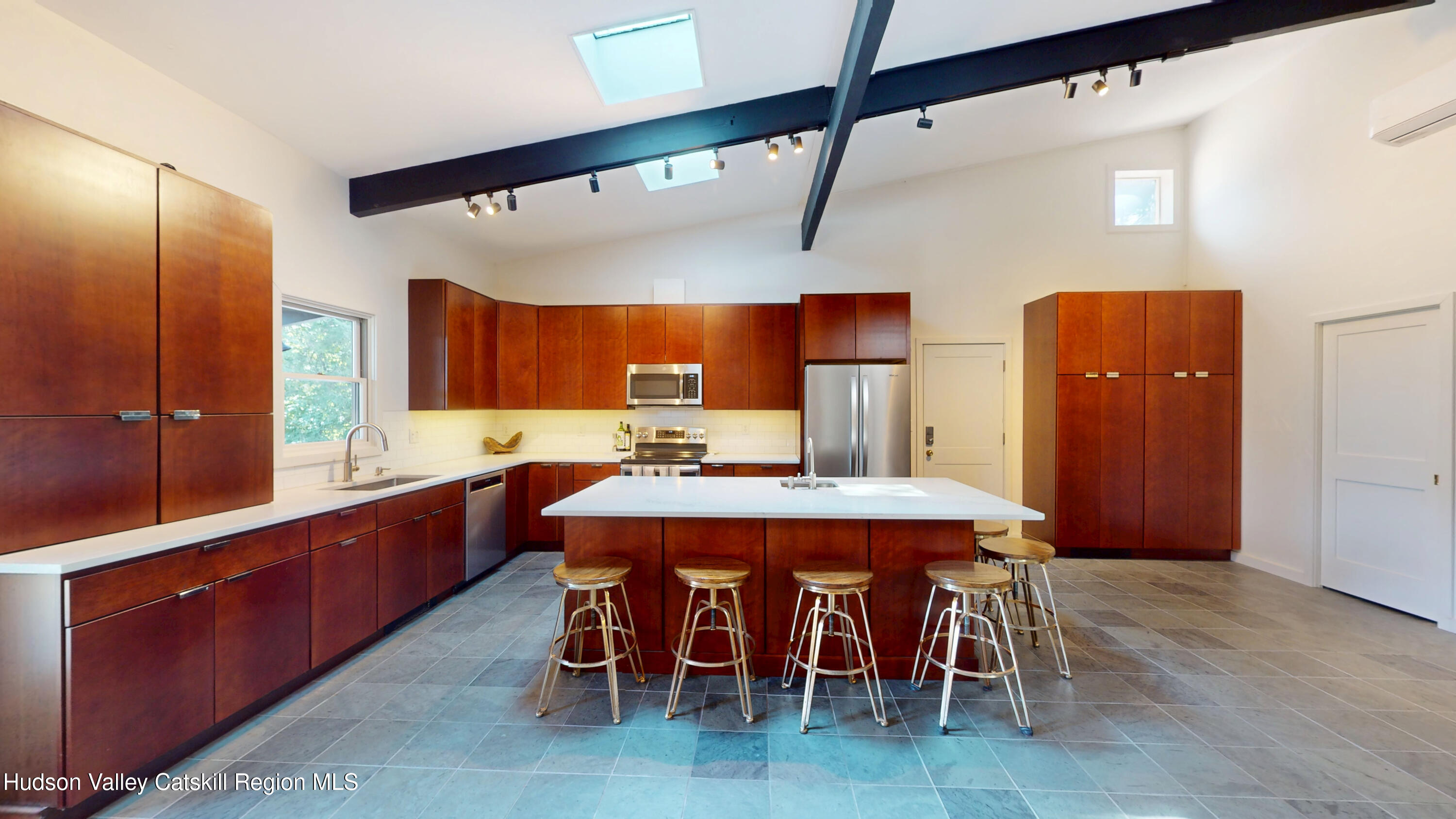 16 Spring Road Hudson, NY 12534 - Photo 3 of 64 a large kitchen with a table and chairs
