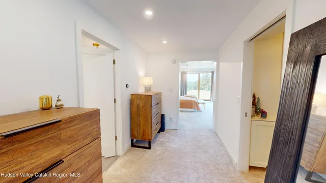 a living room with patio furniture and a floor to ceiling window