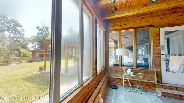 a view of a house with backyard and sitting area