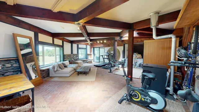 a view of a lake with couches in patio