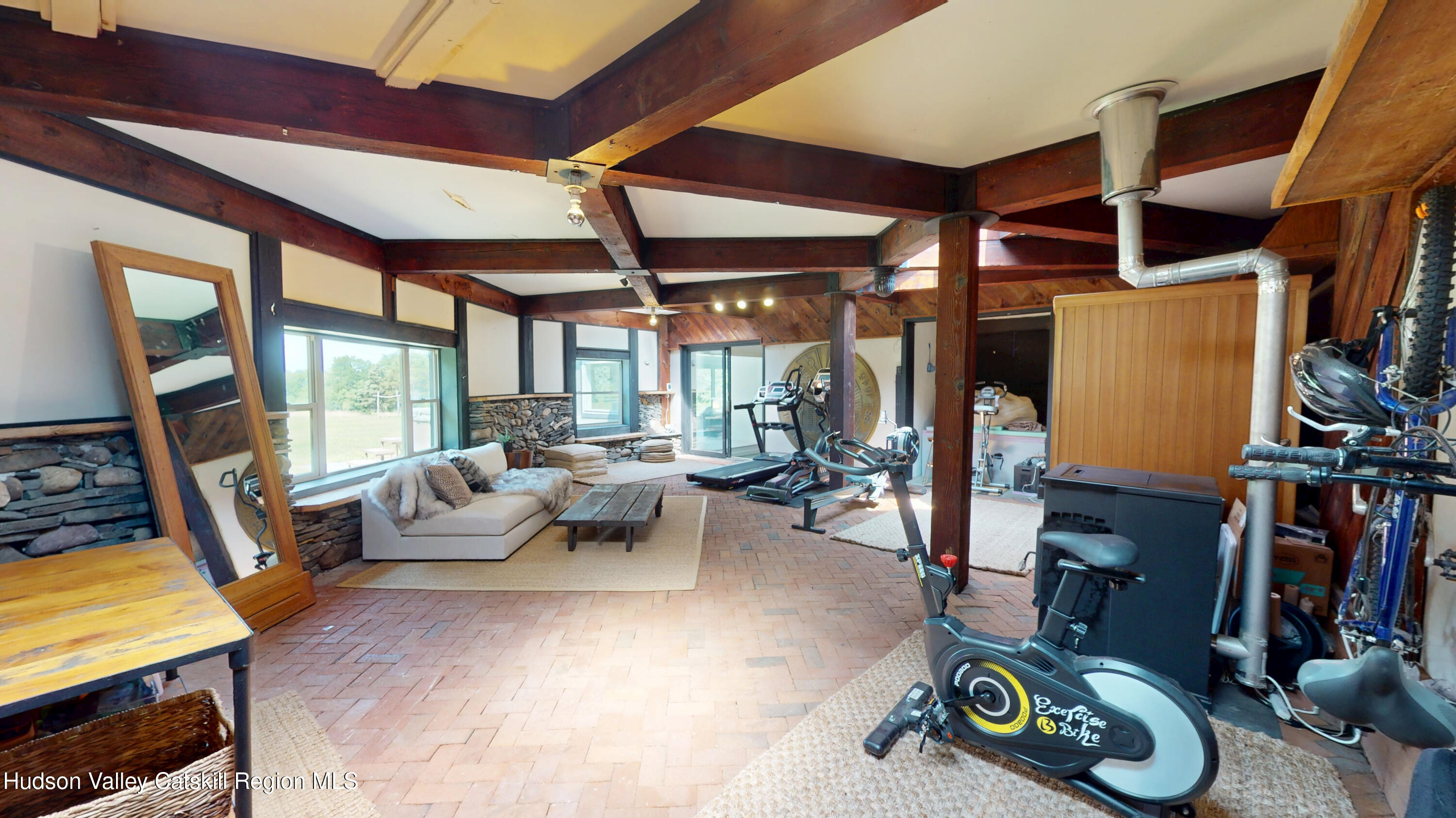 16 Spring Road Hudson, NY 12534 - Photo 46 of 64 a living room with furniture and a flat screen tv