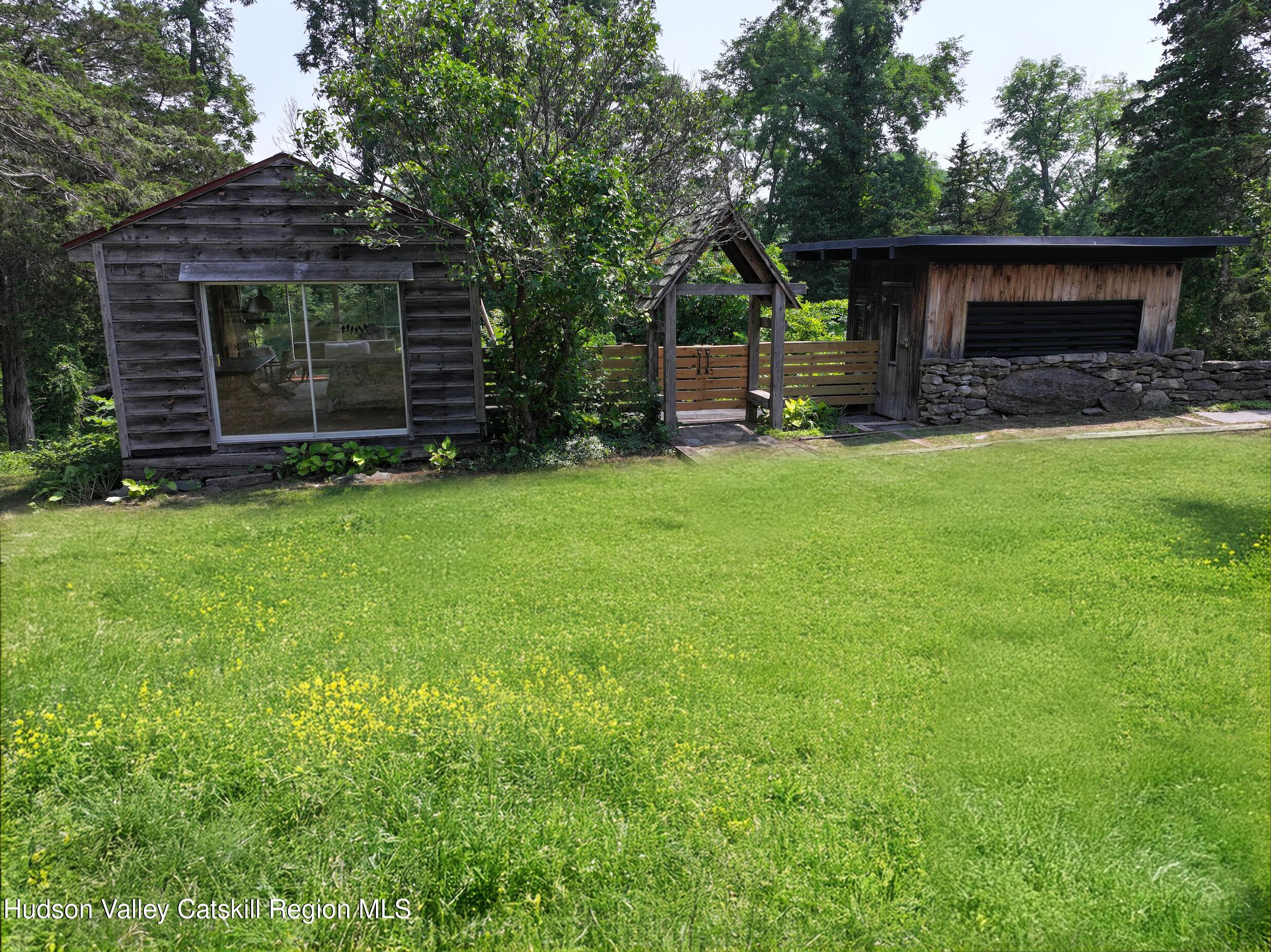 16 Spring Road Hudson, NY 12534 - Photo 48 of 64 a front view of a house with garden