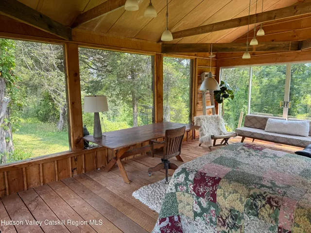 an aerial view of a house with pool garden and mountain view