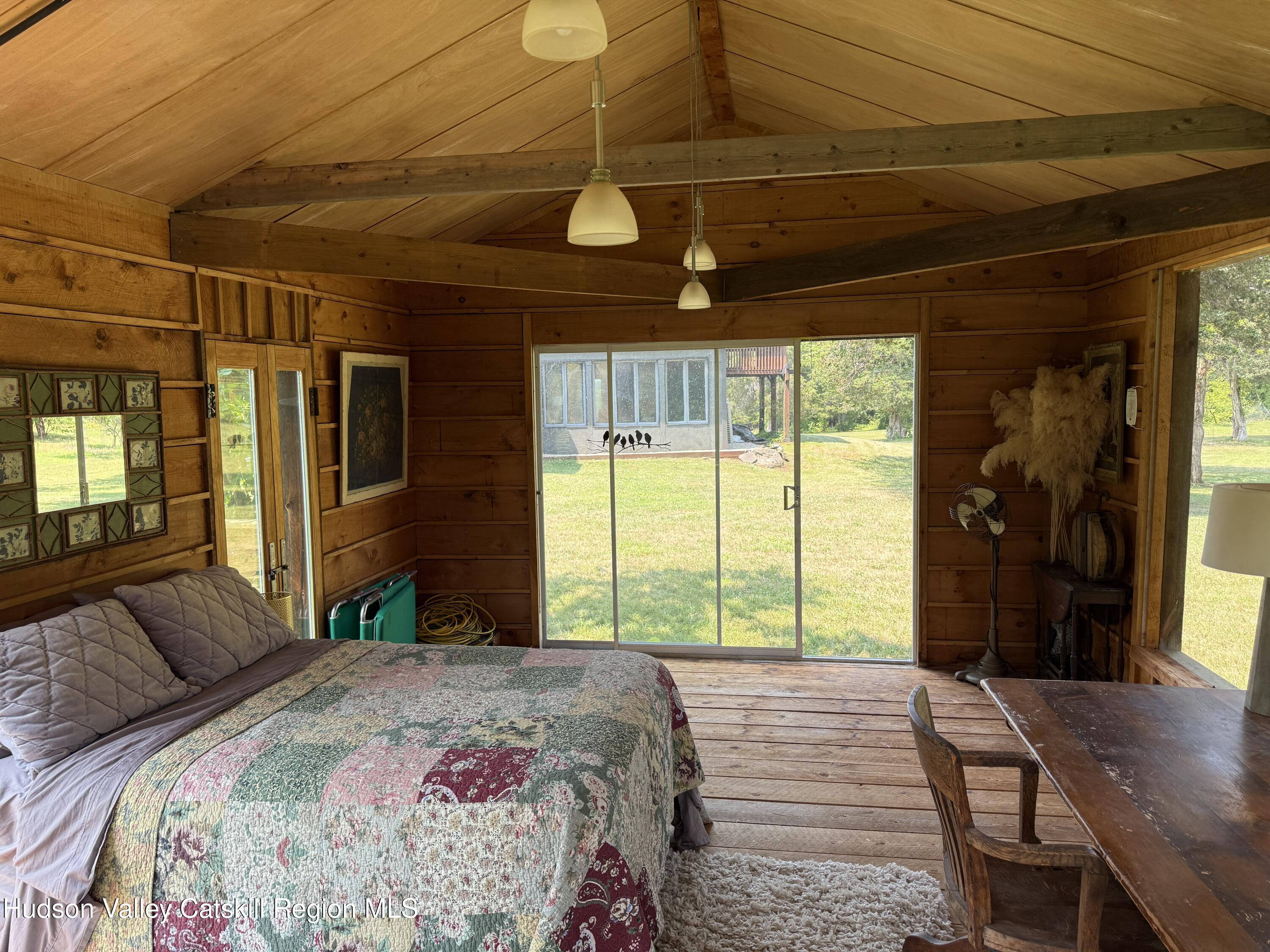 16 Spring Road Hudson, NY 12534 - Photo 51 of 64 a bedroom with a bed and a large window