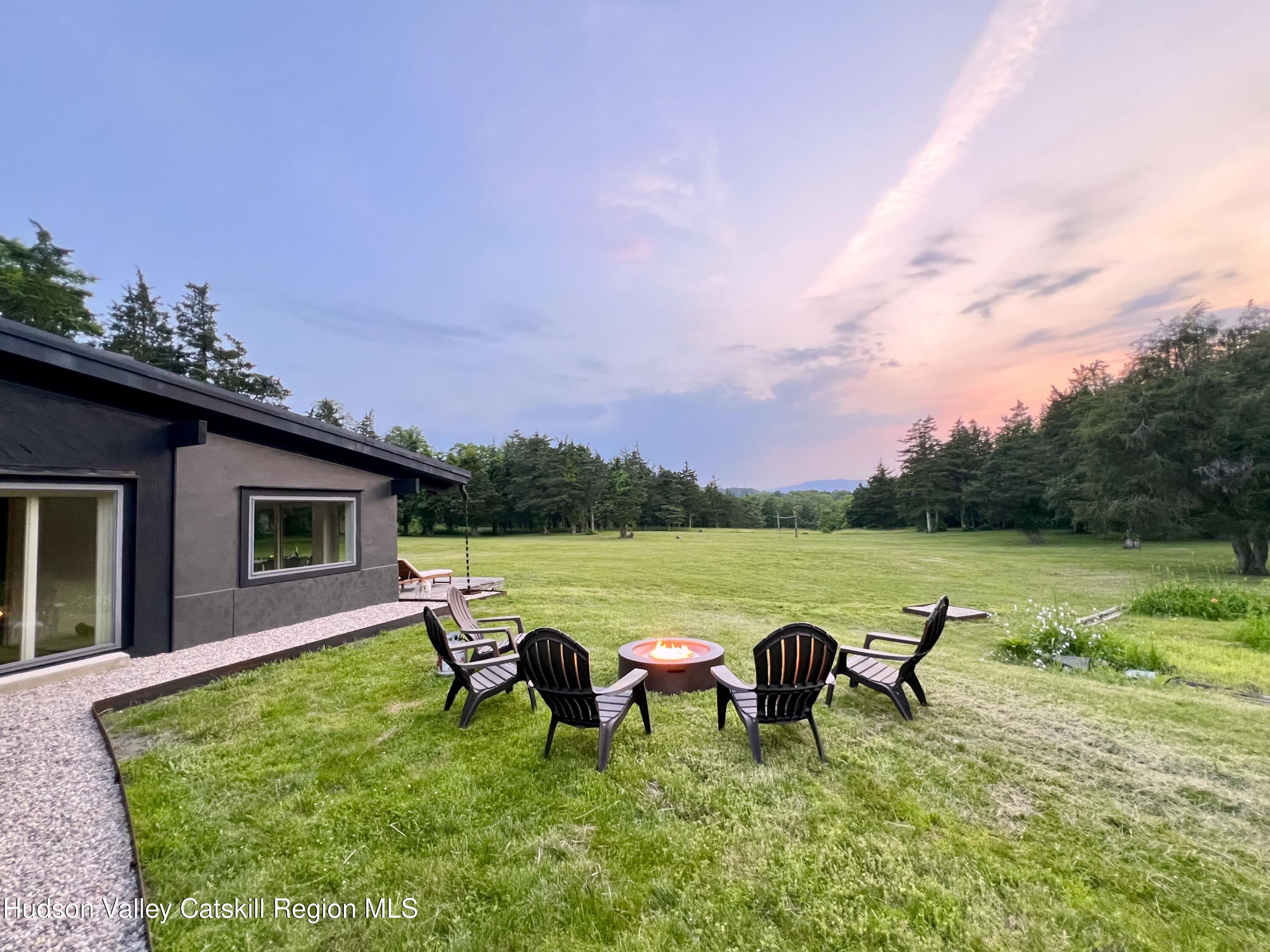 16 Spring Road Hudson, NY 12534 - Photo 58 of 64 a view of a lake with couches in patio