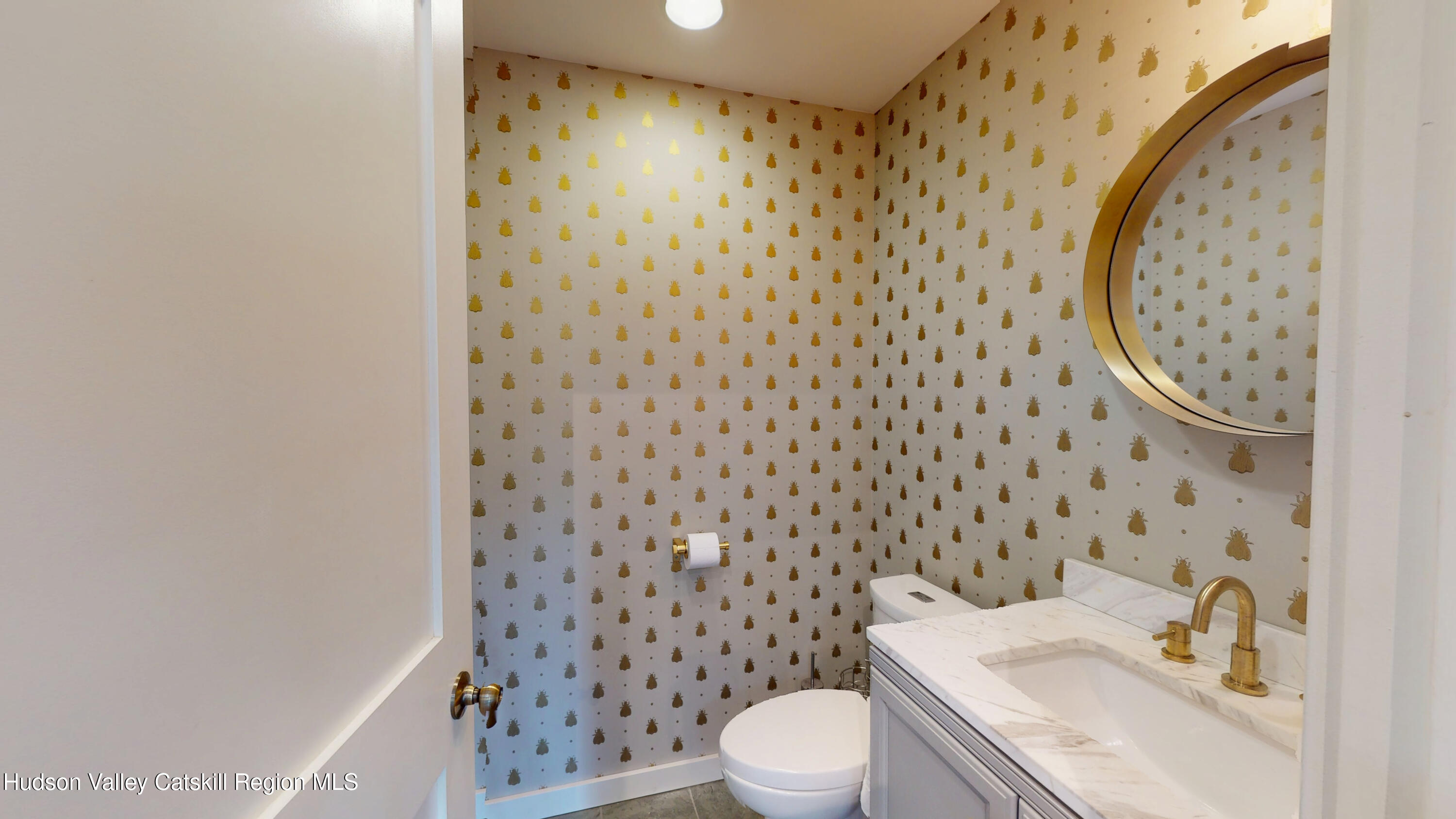 16 Spring Road Hudson, NY 12534 - Photo 6 of 64 a white toilet sitting next to a bathroom sink