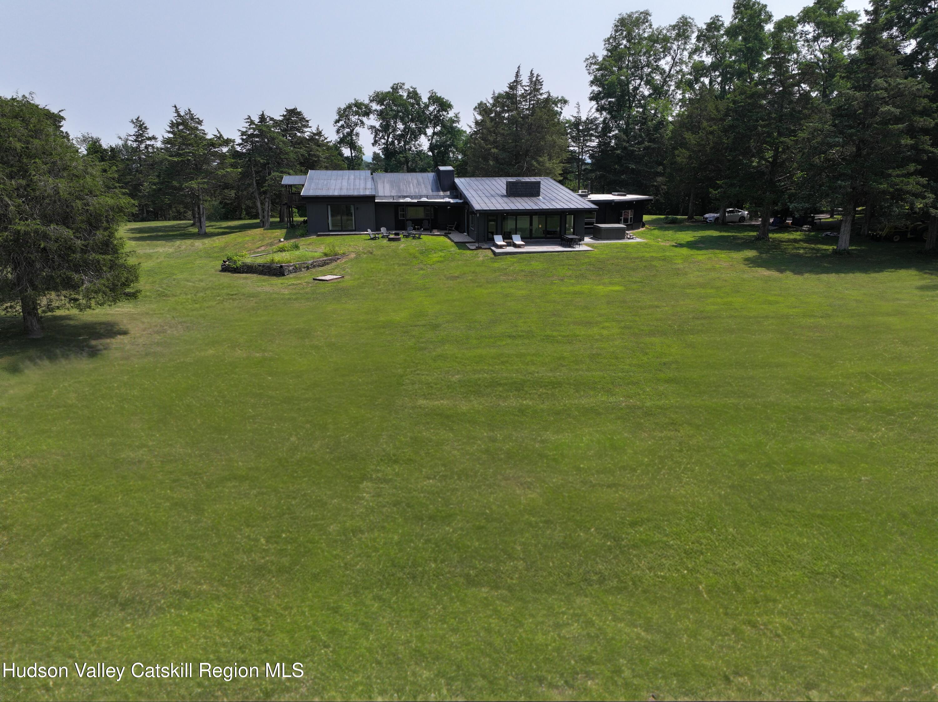 16 Spring Road Hudson, NY 12534 - Photo 64 of 64 a swimming pool with outdoor seating and yard