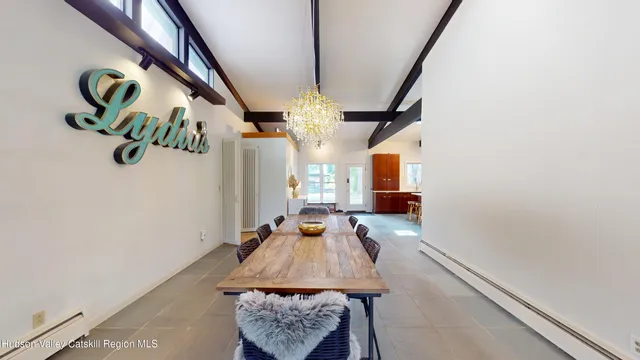 a lobby with furniture and a glass door