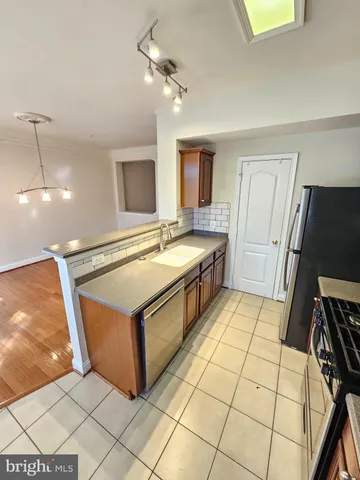 a spacious bathroom with a sink a mirror and bathtub