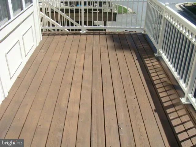 a view of balcony with wooden floor