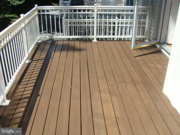 a balcony with wooden floor