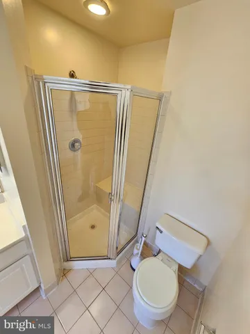 a bathroom with a sink vanity and mirror