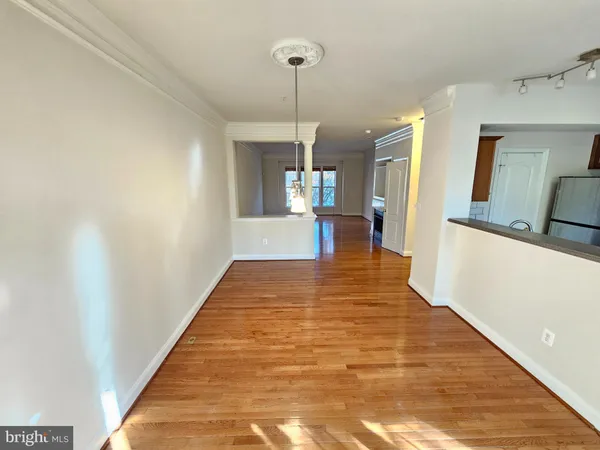 a view of a living room with a wooden floor