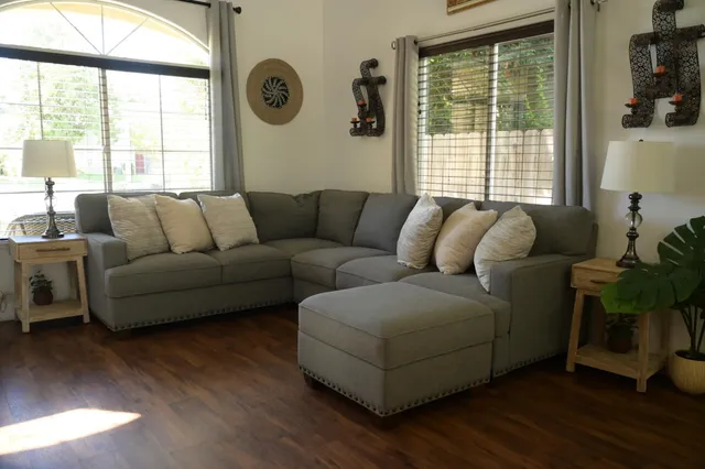 a living room with furniture and a large window