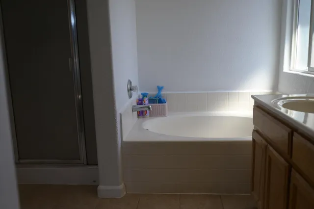 a bathroom with a sink and a window