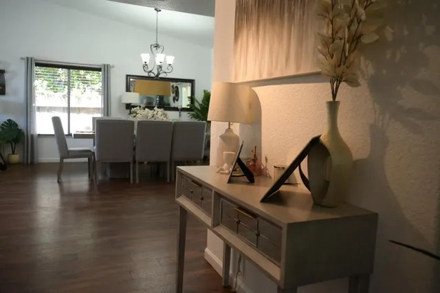 a view of a dining room with furniture and window