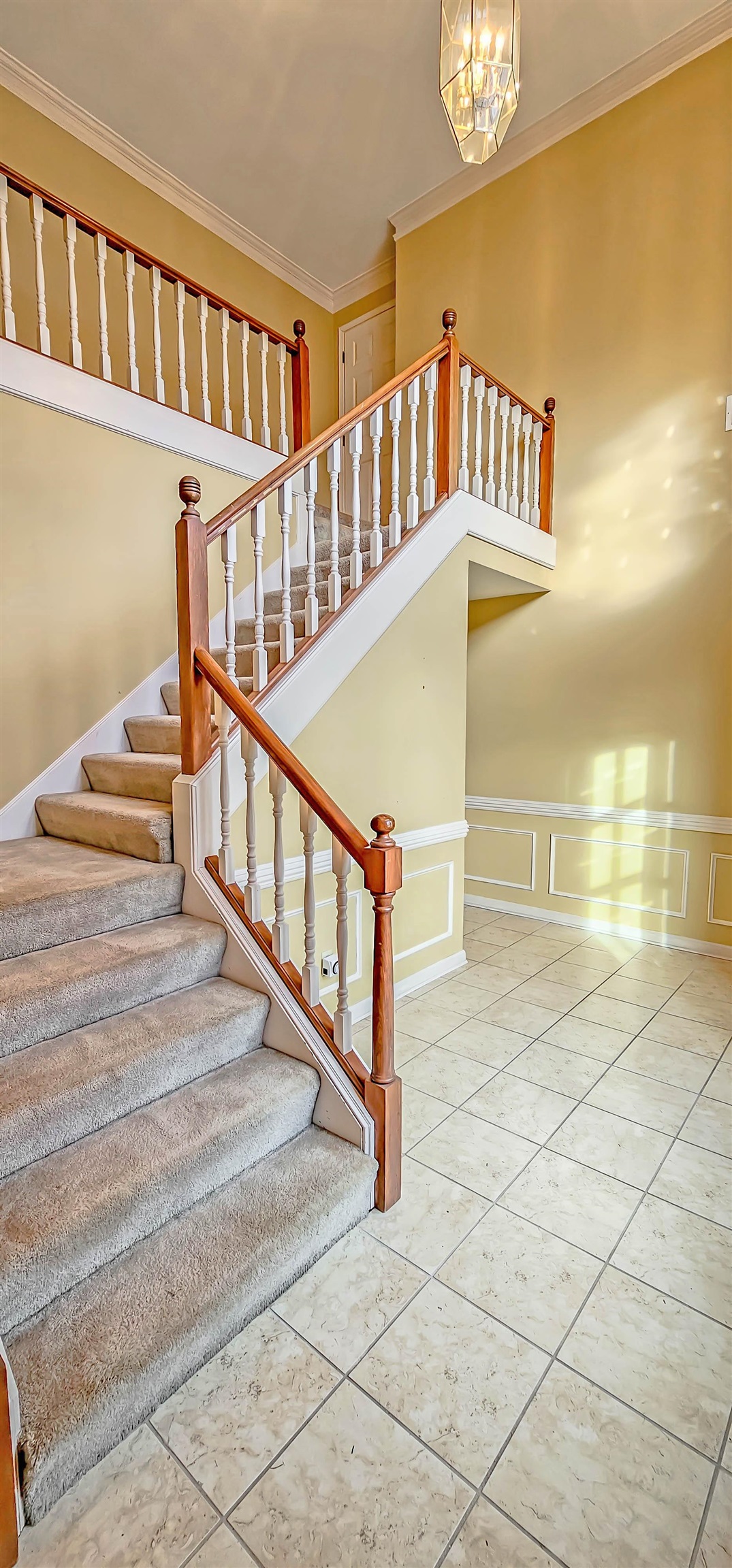 660 Weston Drive Collierville, TN 38017 - Photo 3 of 32 a view of staircase with white walls and a window