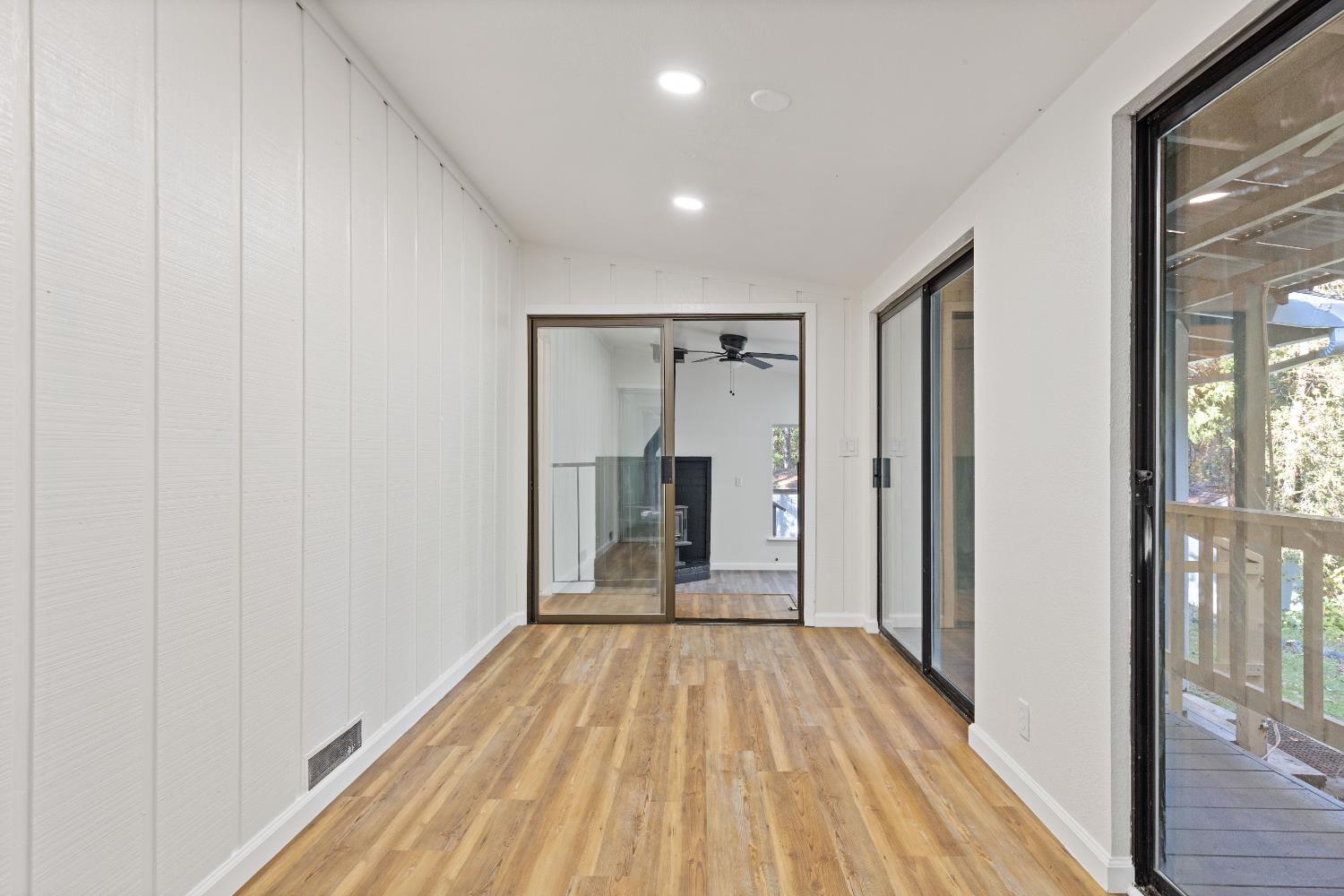 13139 North Meadow View Drive Grass Valley, CA 95945 - Photo 13 of 68 a view of a room with wooden floor air conditioner and windows