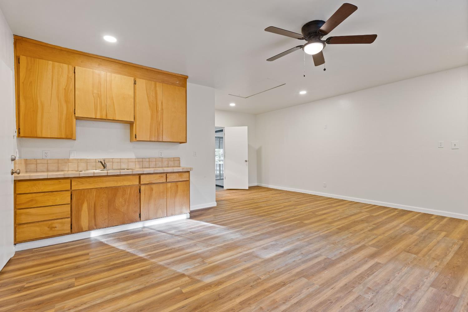 13139 North Meadow View Drive Grass Valley, CA 95945 - Photo 14 of 68 a kitchen with a sink cabinets and wooden floor