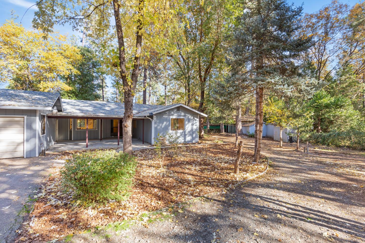 13139 North Meadow View Drive Grass Valley, CA 95945 - Photo 20 of 68 a house with trees in the background