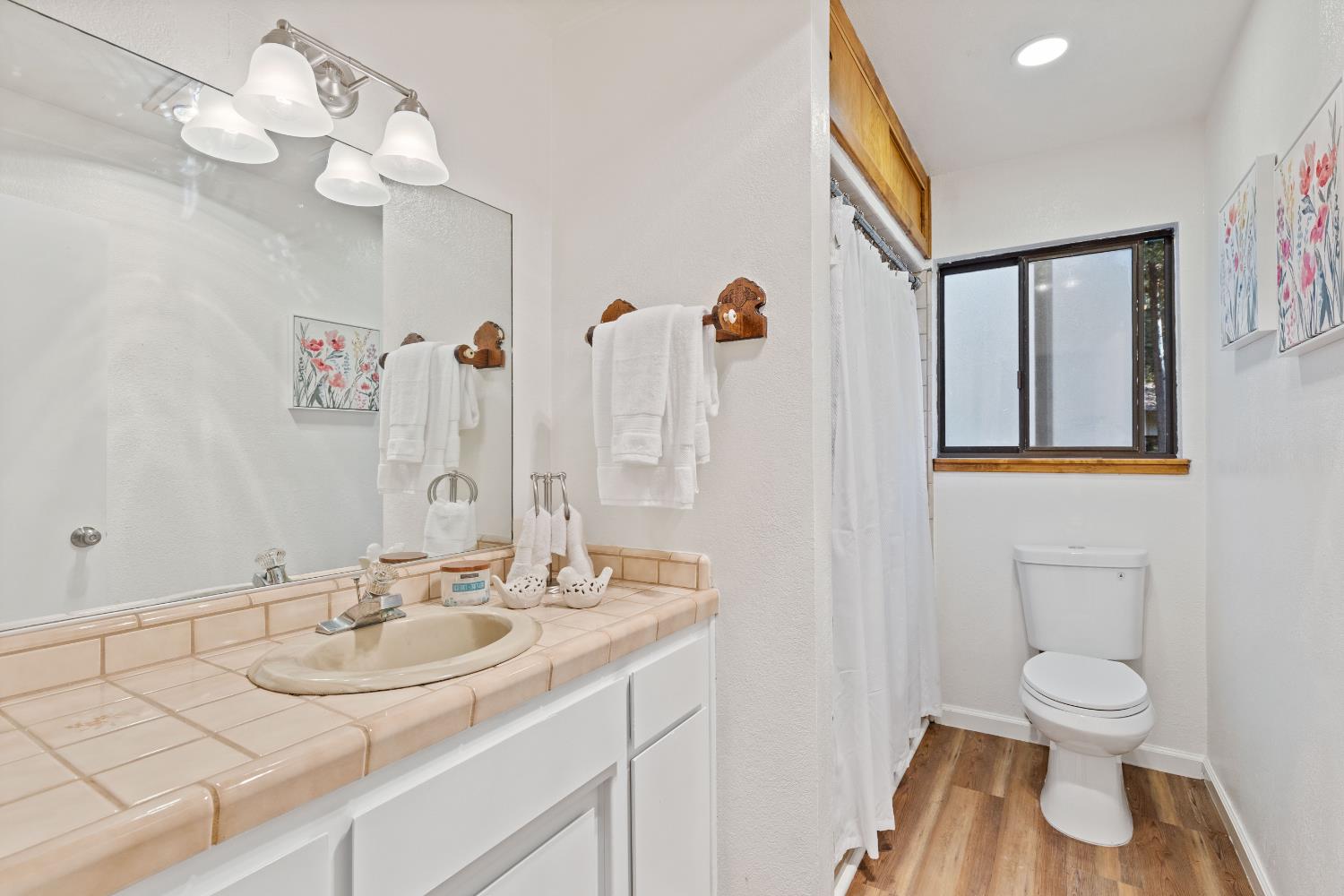 13139 North Meadow View Drive Grass Valley, CA 95945 - Photo 30 of 68 a bathroom with a sink a toilet and a mirror