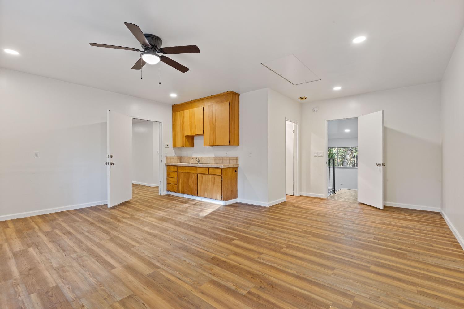 13139 North Meadow View Drive Grass Valley, CA 95945 - Photo 39 of 68 a view of empty room with wooden floor and ceiling fan