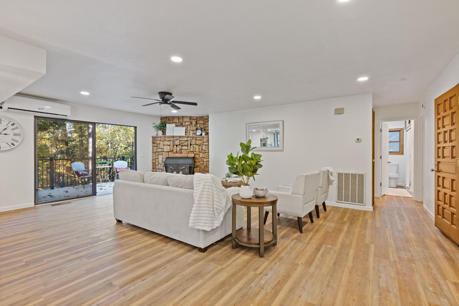 13139 North Meadow View Drive Grass Valley, CA 95945 - Photo 8 of 68 a living room with furniture and a wooden floor