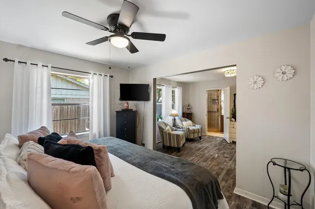a bedroom with furniture and a wooden floor