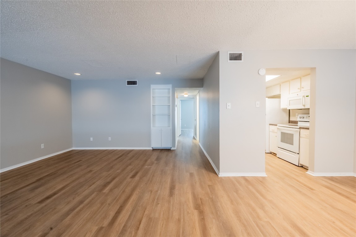 2401 Leon Street, Unit 108 Austin, TX 78705 - Photo 1 of 13 a view of a livingroom with wooden floor