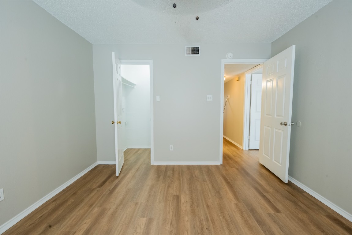 2401 Leon Street, Unit 108 Austin, TX 78705 - Photo 9 of 13 a view of a room with wooden floor