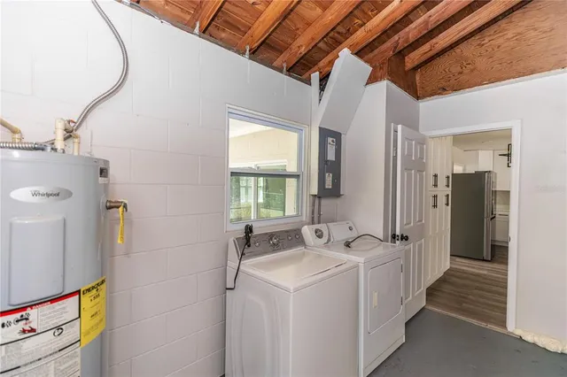 a utility room with dryer and washer