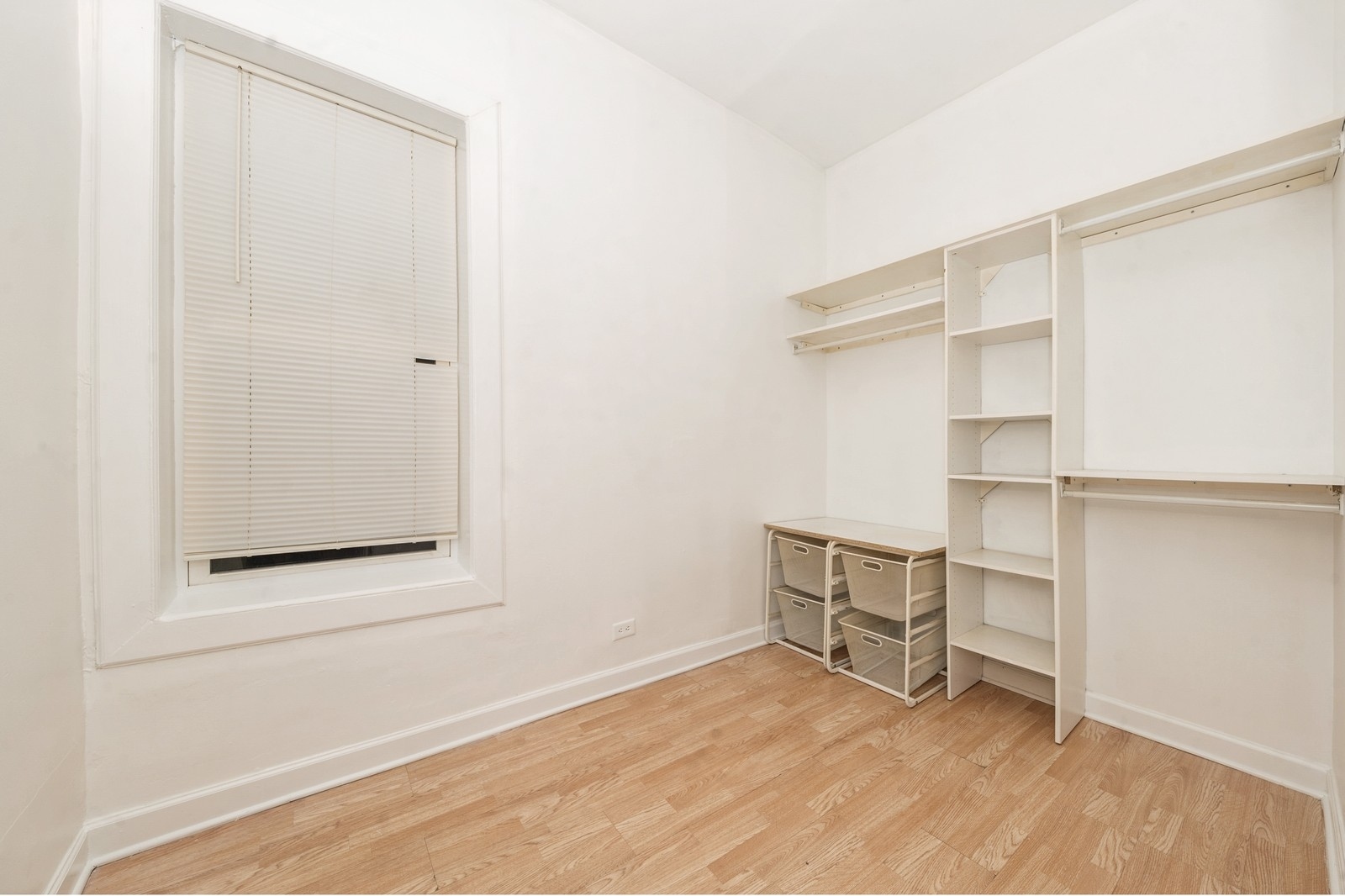 2242 West 19th Street, Unit 1R Chicago, IL 60608 - Photo 9 of 12 a view of an empty room with cabinet and a window