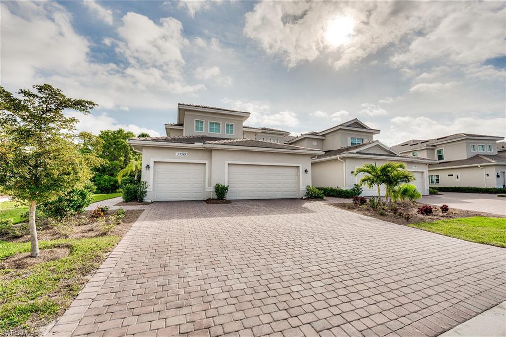 3790 Pebblebrook Ridge Court, Unit 101 Fort Myers, FL 33905 - Photo 2 of 38 a street view with houses