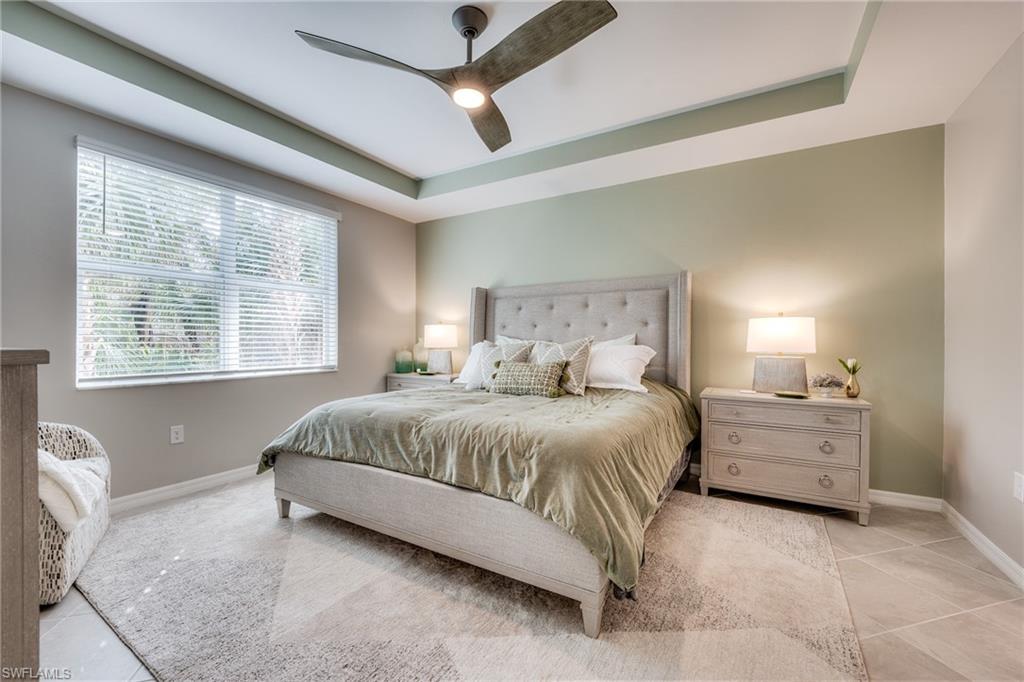 3790 Pebblebrook Ridge Court, Unit 101 Fort Myers, FL 33905 - Photo 26 of 38 a spacious bedroom with a bed and a window