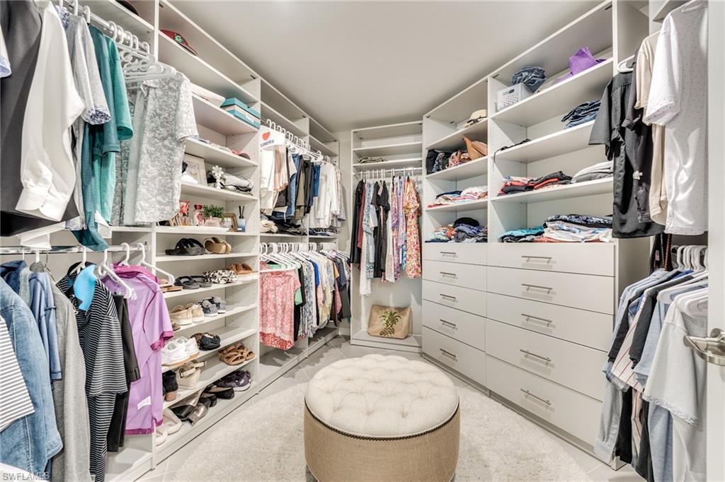 3790 Pebblebrook Ridge Court, Unit 101 Fort Myers, FL 33905 - Photo 33 of 38 a view of walk in closet with clothes and shoes
