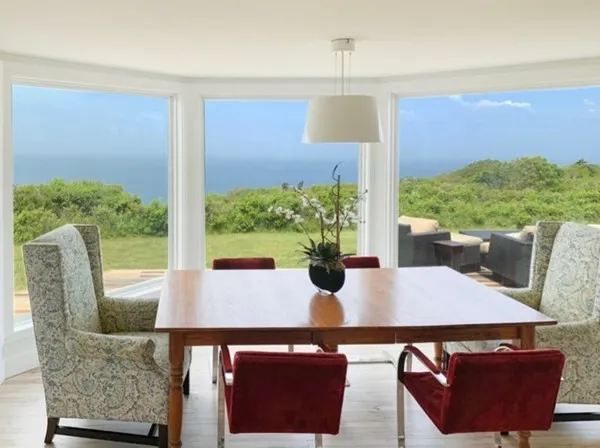 a view of a dining room with furniture window and outside view