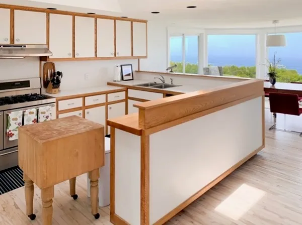 a kitchen with a sink cabinets and window