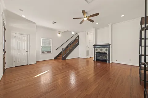 a kitchen with stainless steel appliances granite countertop white cabinets a sink a stove and a microwave