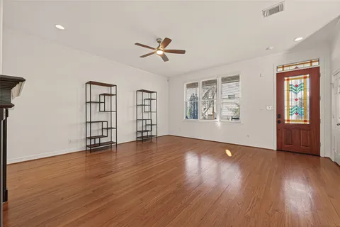 a kitchen with stainless steel appliances white cabinets and a refrigerator