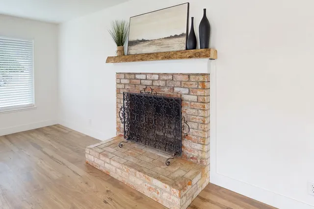 with a fireplace with wooden floor
