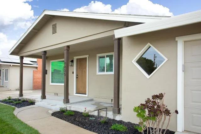 a front view of a house with garden