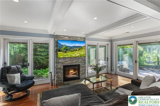 a spacious bathroom with a tub sink and mirror
