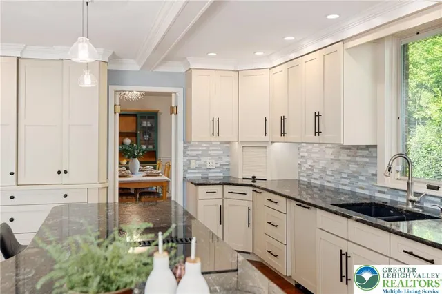 a bathroom with a glass shower door